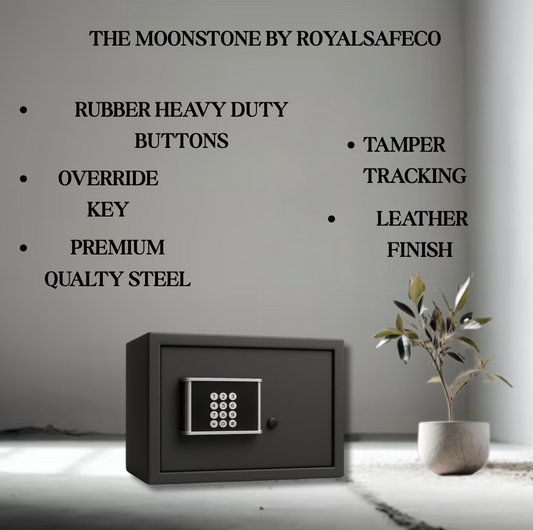 The Moonstone black digital safe with rubber heavy duty buttons, override key, premium steel, tamper tracking, and leather finish on floor with plant